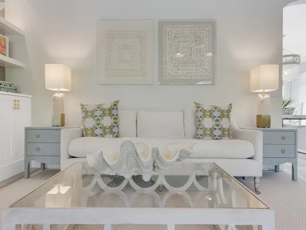 a living room with furniture and a lamp