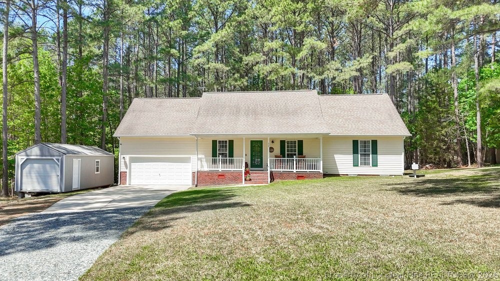 408 Senter Lane Spring Lake, NC 28390 - Photo 1 of 30 front view of a house with a big yard and large trees