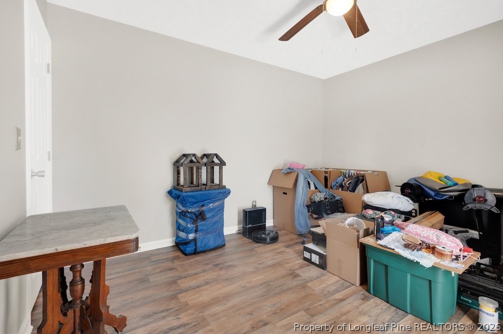 408 Senter Lane Spring Lake, NC 28390 - Photo 12 of 30 a bed room with a bed and a lamp