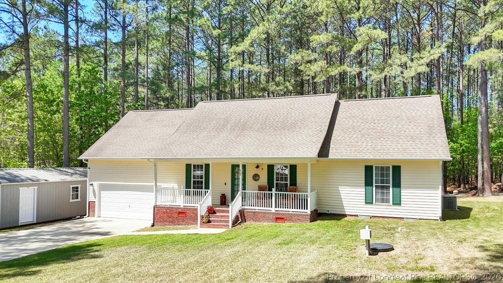 408 Senter Lane Spring Lake, NC 28390 - Photo 25 of 30 front view of a house with a yard table and chairs