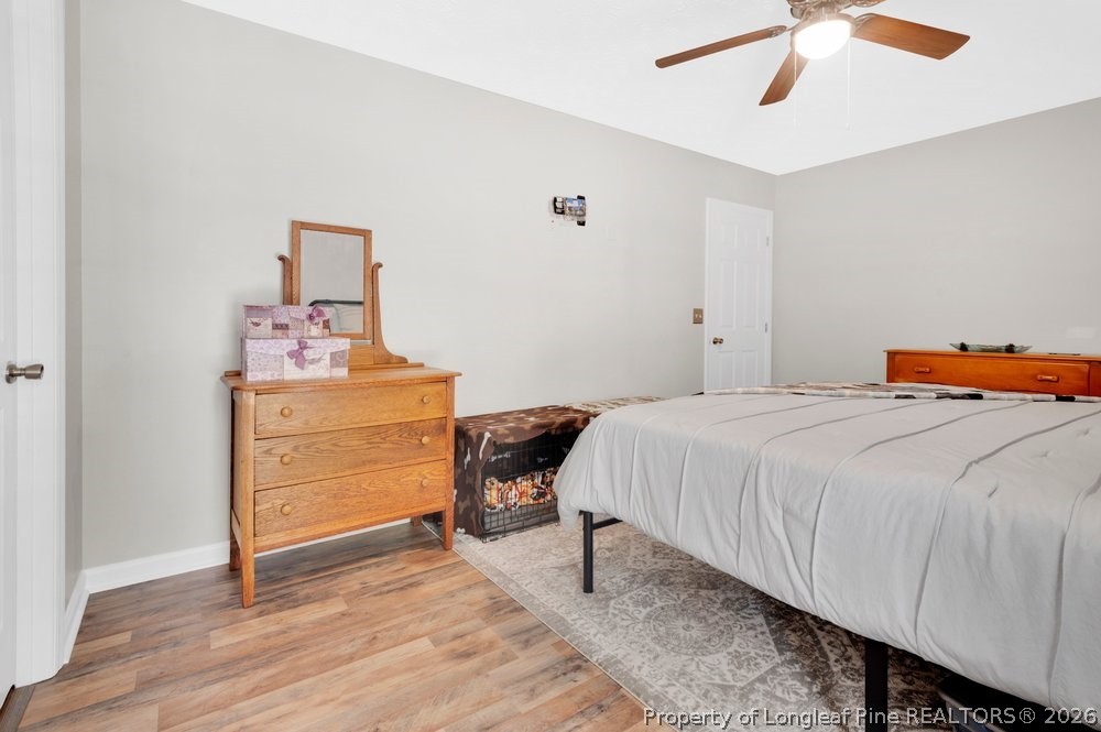 408 Senter Lane Spring Lake, NC 28390 - Photo 7 of 30 a bedroom with a bed and a dresser