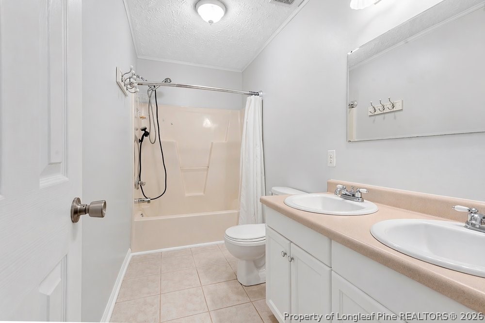 408 Senter Lane Spring Lake, NC 28390 - Photo 8 of 30 a bathroom with a granite countertop sink a toilet and shower