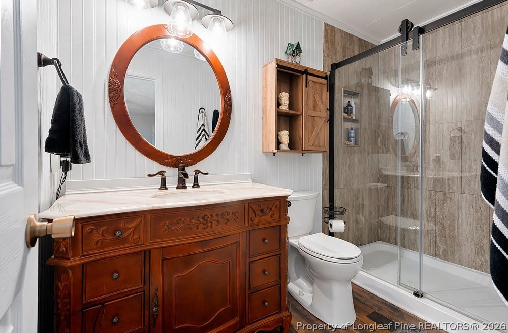 408 Senter Lane Spring Lake, NC 28390 - Photo 10 of 30 a bathroom with a sink a toilet and a mirror