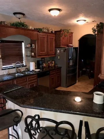 a kitchen with a sink and a stove