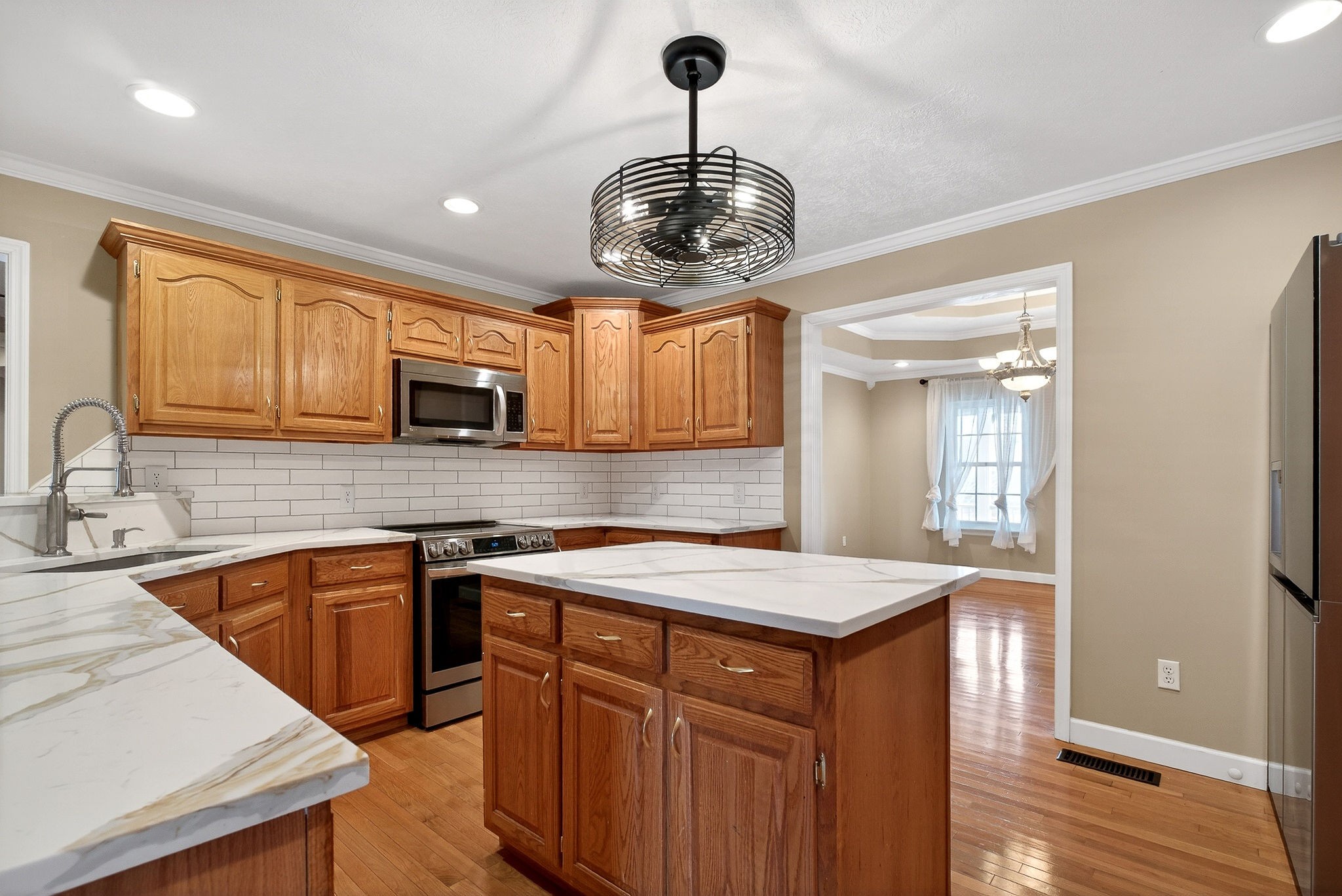 2408 Shellsford Road McMinnville, TN 37110 - Photo 11 of 60 a kitchen with a sink a counter space cabinets and wooden floor