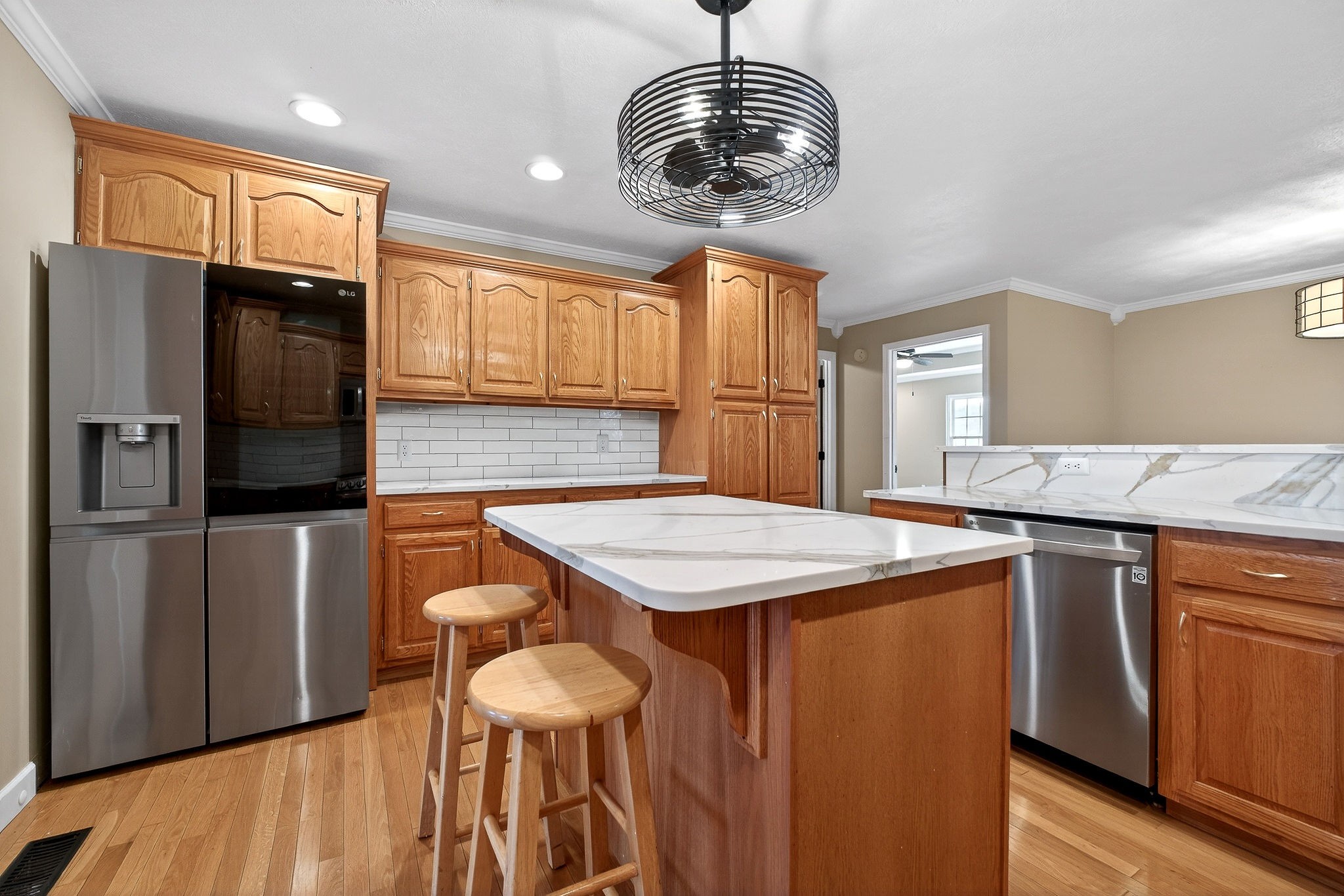 2408 Shellsford Road McMinnville, TN 37110 - Photo 14 of 60 a kitchen with stainless steel appliances kitchen island a table chairs and wooden floor