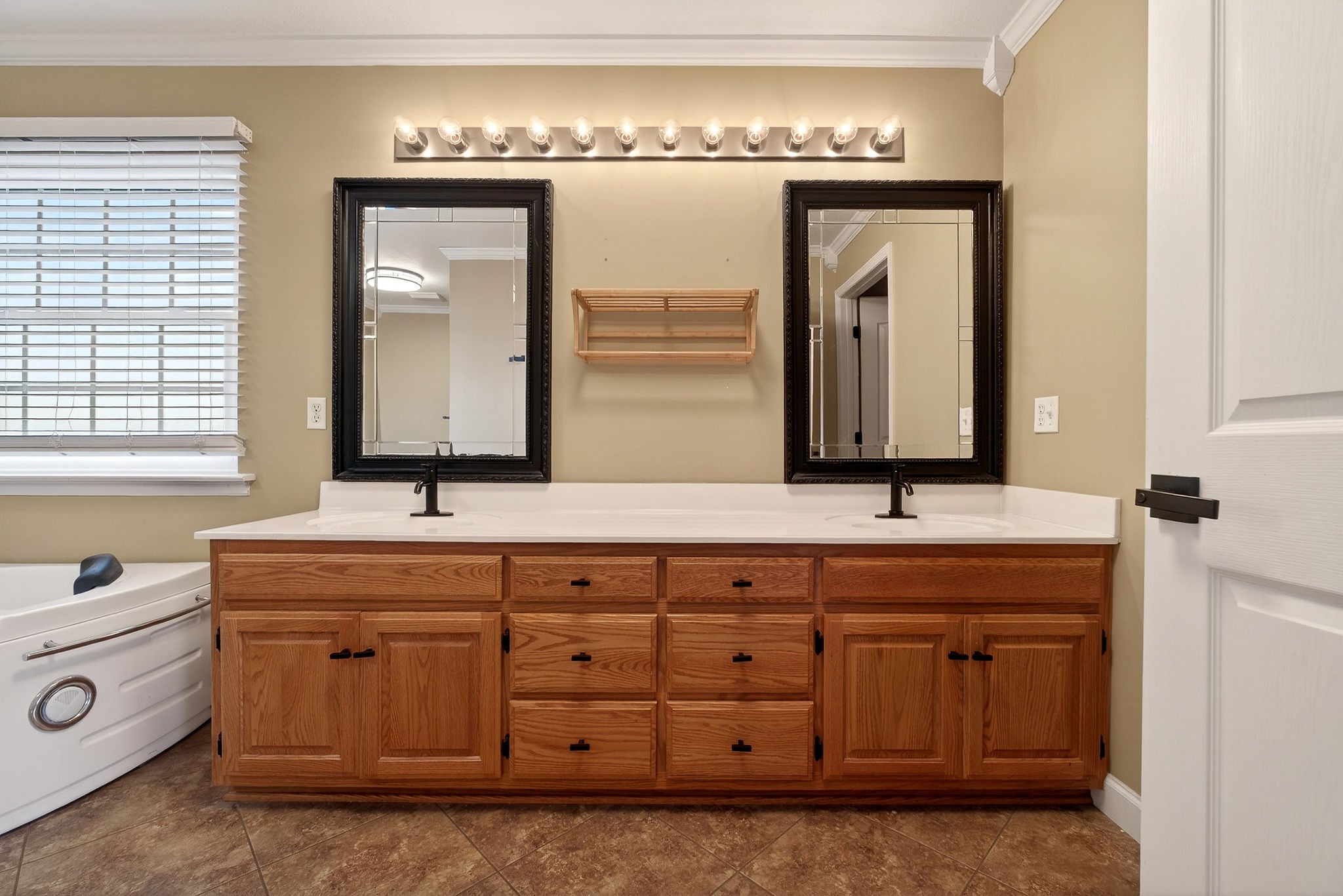 2408 Shellsford Road McMinnville, TN 37110 - Photo 27 of 60 a bathroom with a double vanity sink mirror and