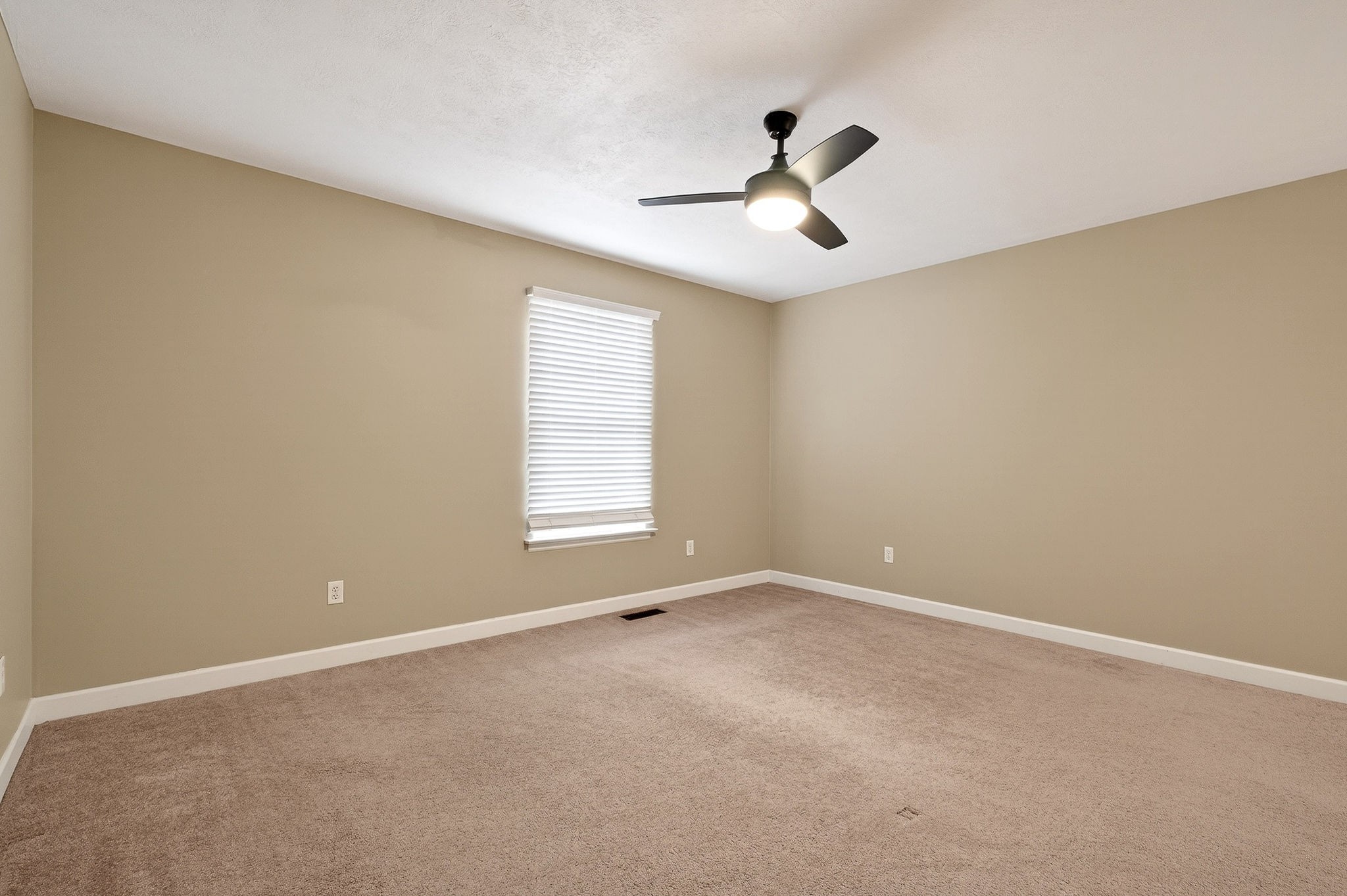 2408 Shellsford Road McMinnville, TN 37110 - Photo 35 of 60 an empty room with ceiling fan and windows