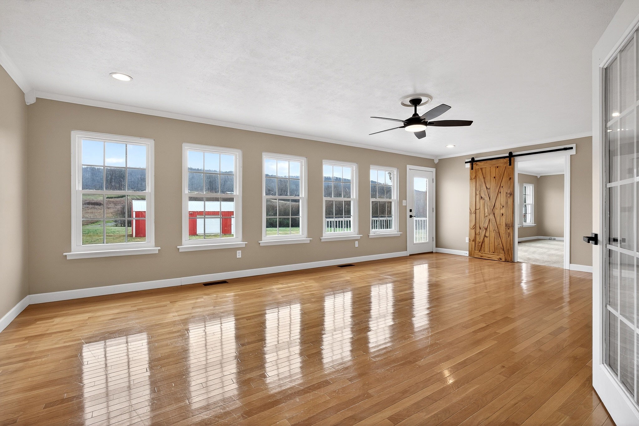2408 Shellsford Road McMinnville, TN 37110 - Photo 40 of 60 a view of an empty room with window and wooden floor