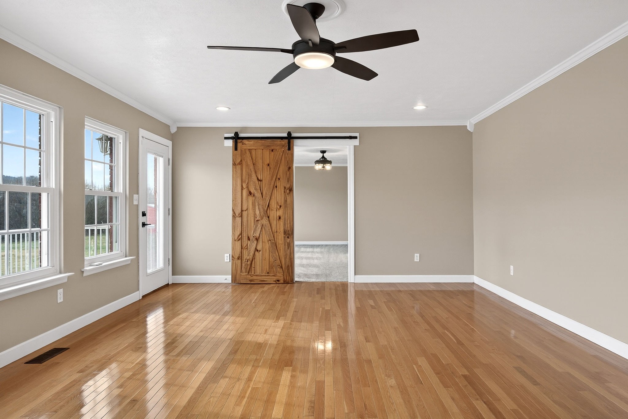 2408 Shellsford Road McMinnville, TN 37110 - Photo 41 of 60 a view of an empty room with window and wooden floor