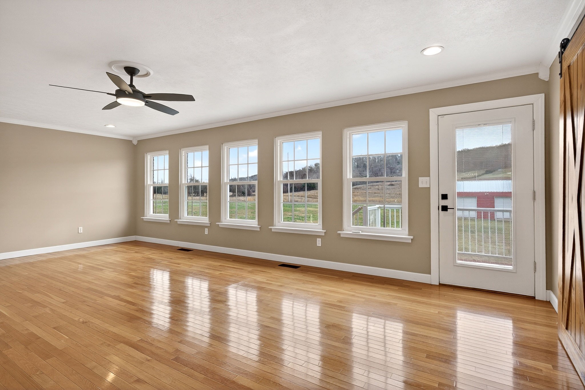 2408 Shellsford Road McMinnville, TN 37110 - Photo 43 of 60 a view of empty room with wooden floor and fan