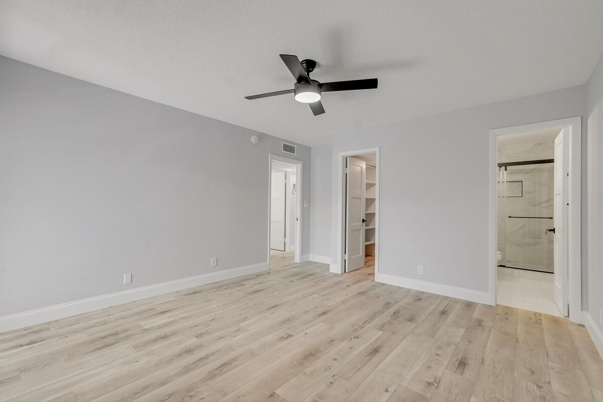 15072 Ashland Place, Unit 132 Delray Beach, FL 33484 - Photo 15 of 38 wooden floor in an empty room