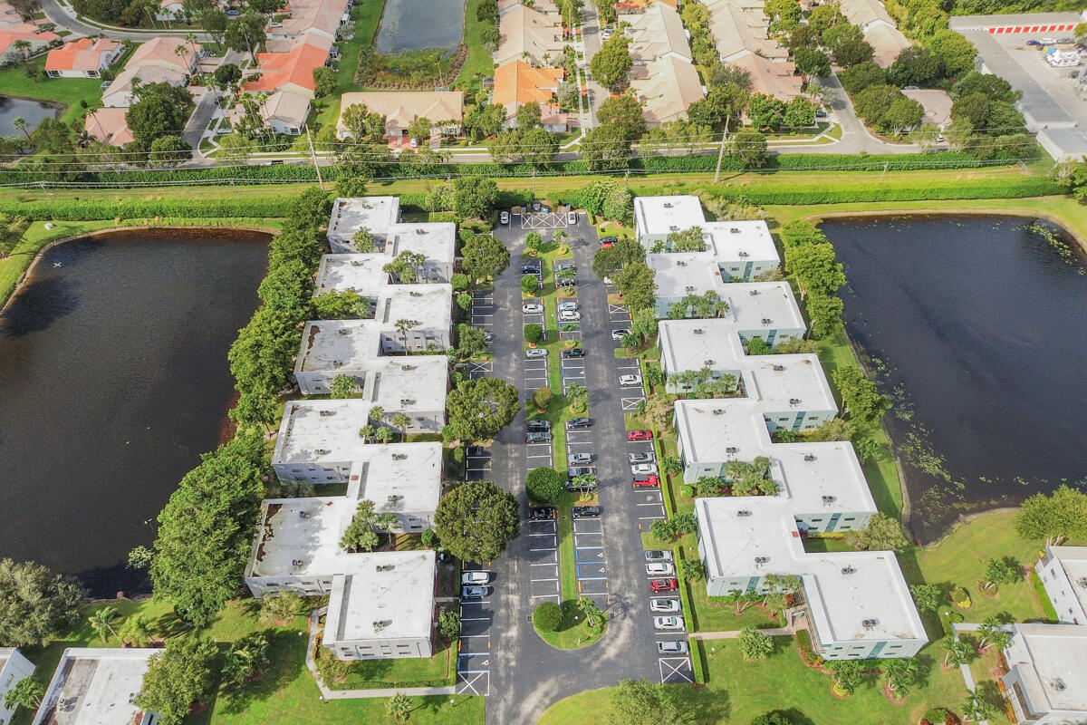 15072 Ashland Place, Unit 132 Delray Beach, FL 33484 - Photo 30 of 38 an aerial view of residential building with outdoor space and pool