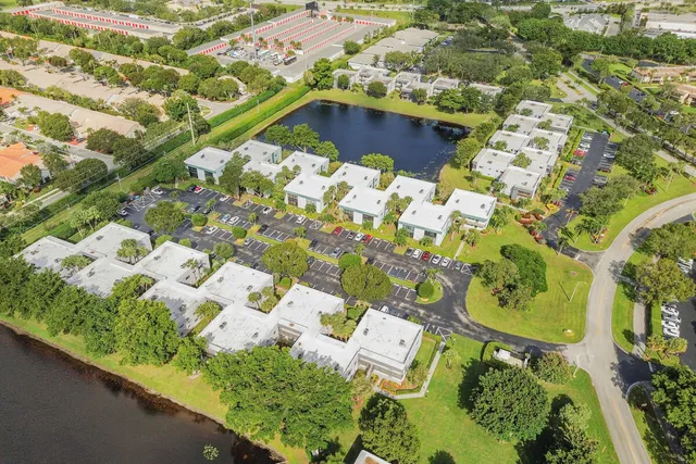 an aerial view of a house with a yard and plants