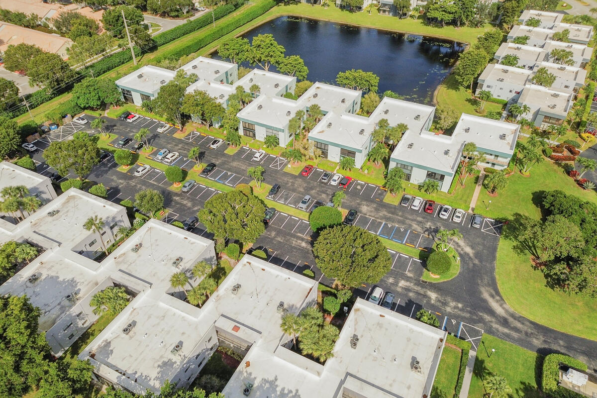 15072 Ashland Place, Unit 132 Delray Beach, FL 33484 - Photo 33 of 38 an aerial view of a house with a yard and plants