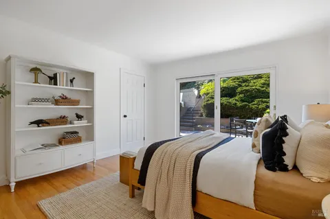 a bed room with a bed and a window