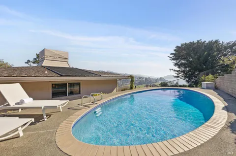 a view of a house with swimming pool