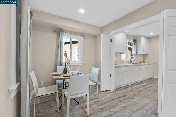 a view of a dining room with furniture and window