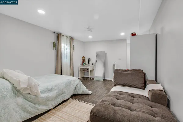 a bedroom with furniture and a couch