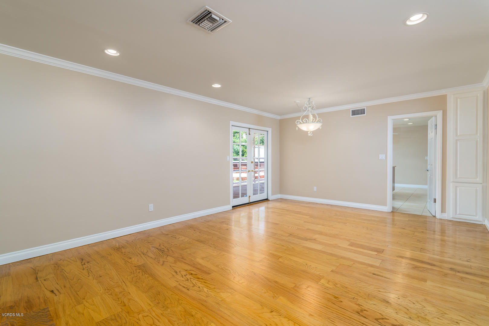 18932 Olympia Street Porter Ranch, CA 91326 - Photo 11 of 39 a view of an empty room with wooden floor and a window