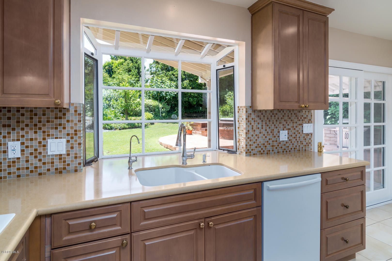 18932 Olympia Street Porter Ranch, CA 91326 - Photo 16 of 39 a kitchen with a sink and large window