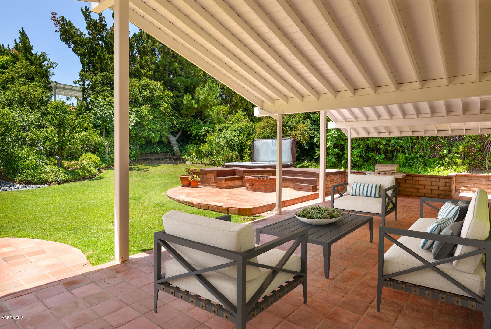 18932 Olympia Street Porter Ranch, CA 91326 - Photo 17 of 39 a view of a patio with a table chairs and a backyard