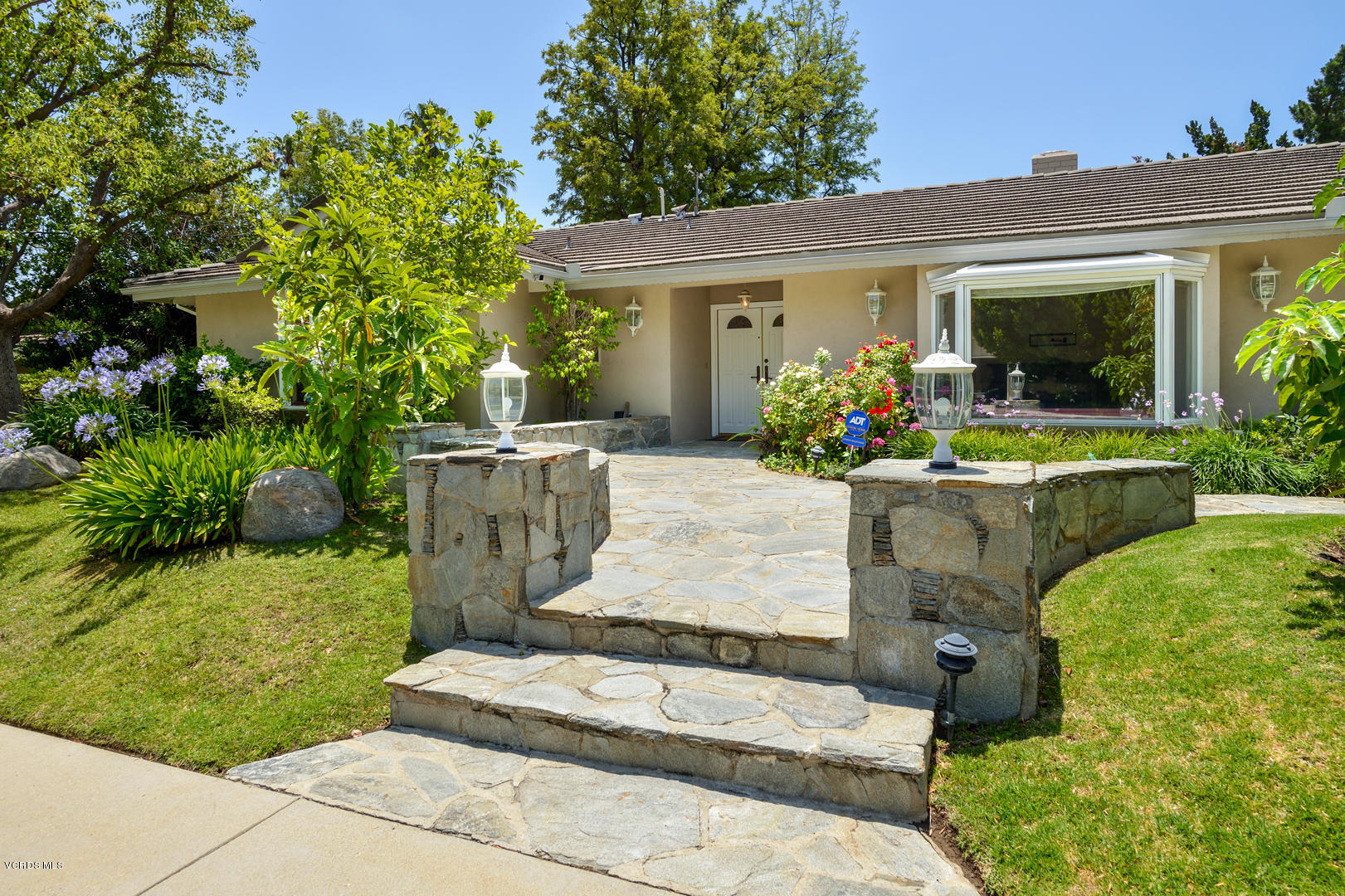 18932 Olympia Street Porter Ranch, CA 91326 - Photo 2 of 39 front view of a house with a yard