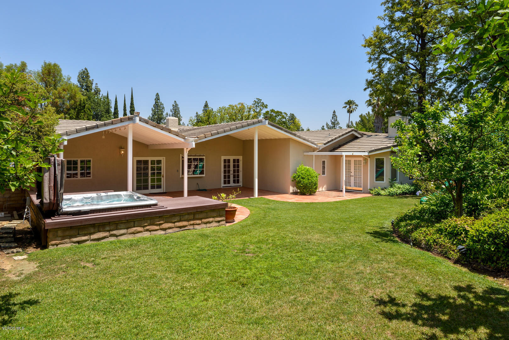 18932 Olympia Street Porter Ranch, CA 91326 - Photo 24 of 39 a front view of a house with a garden and porch