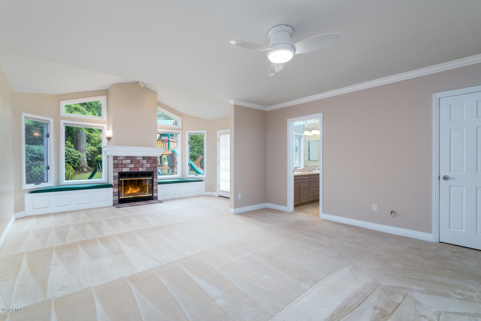 18932 Olympia Street Porter Ranch, CA 91326 - Photo 26 of 39 a view of a livingroom with a fireplace and window