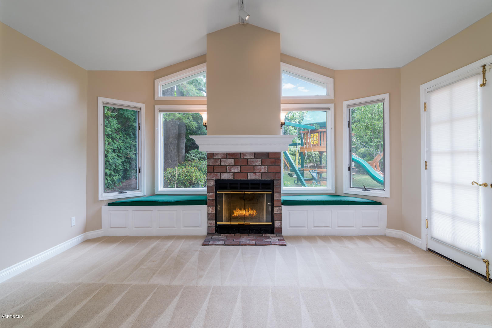 18932 Olympia Street Porter Ranch, CA 91326 - Photo 27 of 39 an empty room with furniture and a fireplace