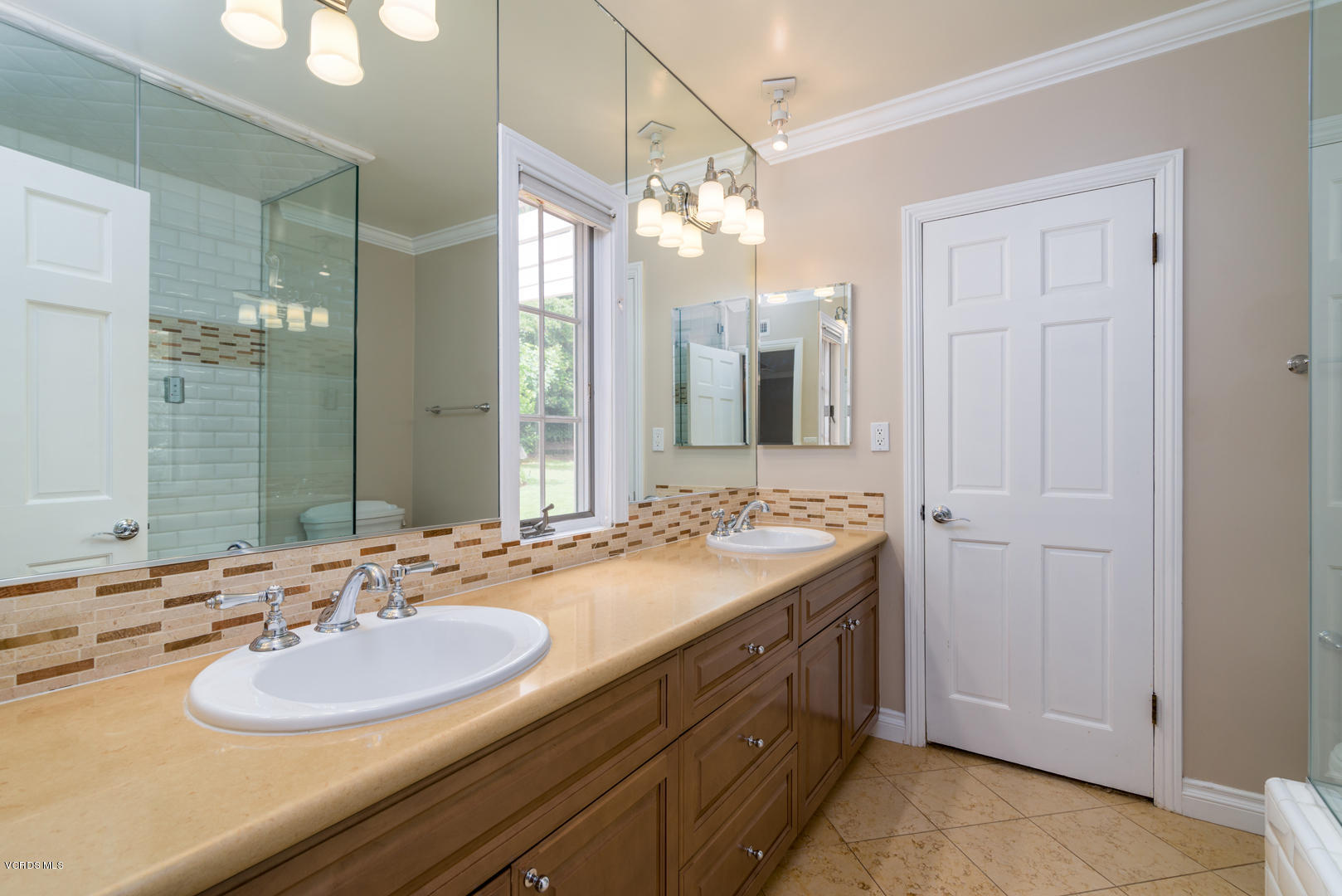 18932 Olympia Street Porter Ranch, CA 91326 - Photo 29 of 39 a bathroom with a sink and a mirror