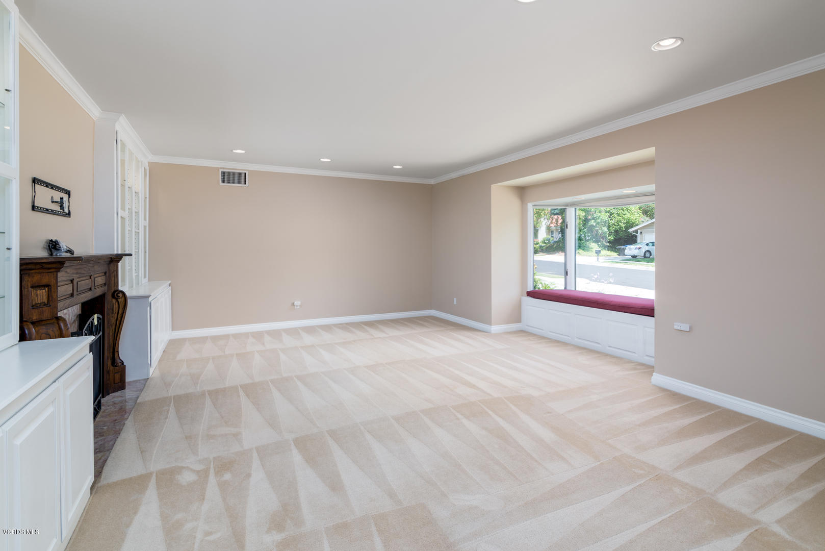 18932 Olympia Street Porter Ranch, CA 91326 - Photo 6 of 39 a view of empty room with window and fireplace
