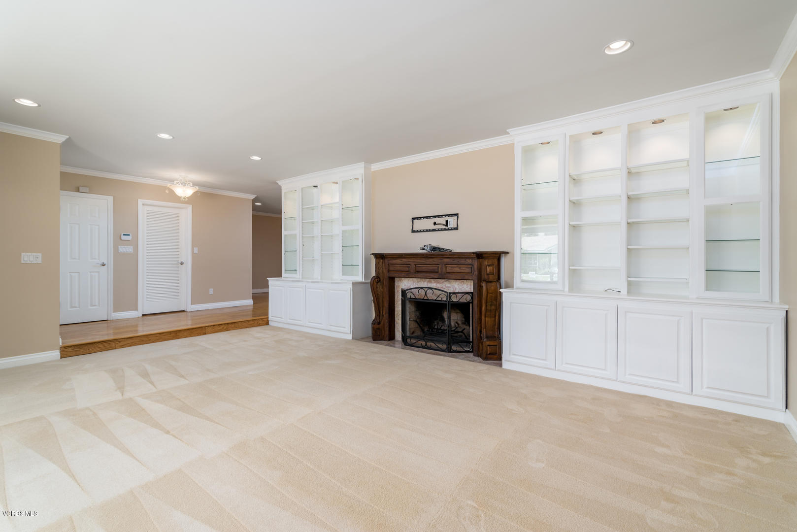 18932 Olympia Street Porter Ranch, CA 91326 - Photo 8 of 39 a view of an empty room with a fireplace