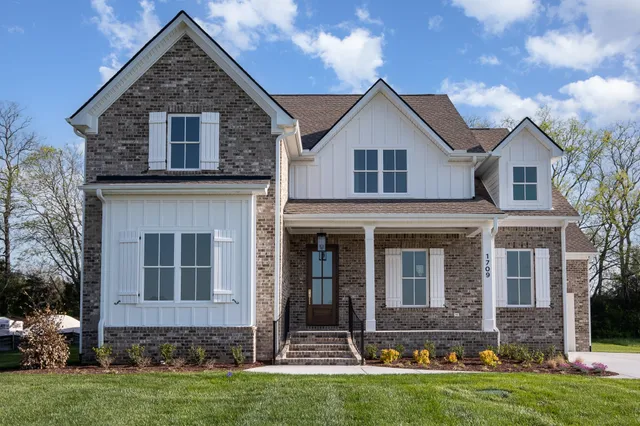 front view of a house with a yard