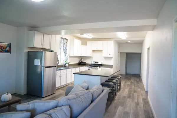 a kitchen with a refrigerator a sink and a stove
