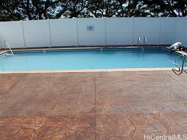 a view of a kitchen with cabinets and a stove