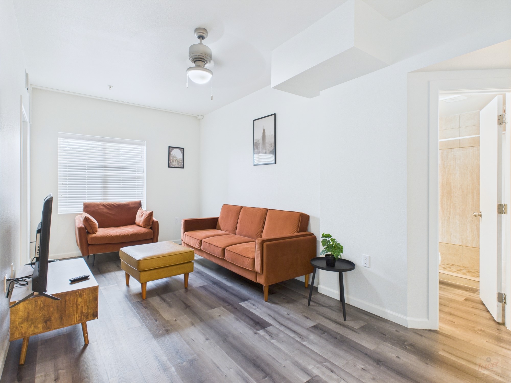 911 West 22nd Street, Unit 306 Austin, TX 78705 - Photo 5 of 12 a living room with furniture and a wooden floor