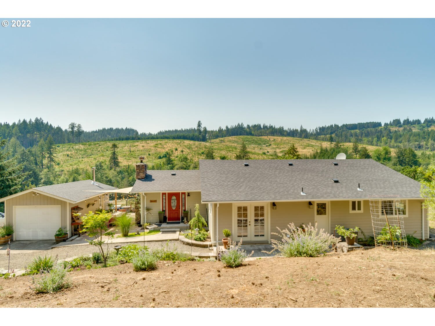 12751 Dupee Valley Road Sheridan, OR 97378 - Photo 1 of 32 a front view of a house with a garden and lake view