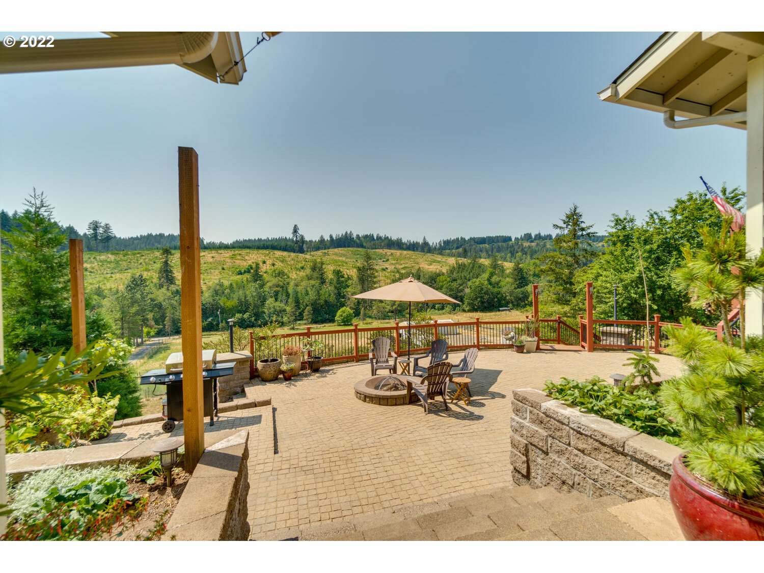 12751 Dupee Valley Road Sheridan, OR 97378 - Photo 23 of 32 a view of a patio with table and chairs potted plants with wooden floor