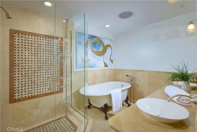 a bathroom with a sink toilet and a shower