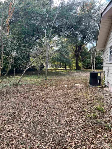 a backyard of a house with lots of green space