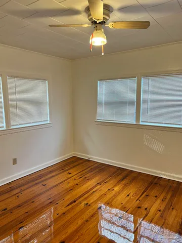 a view of room with window and ceiling fan