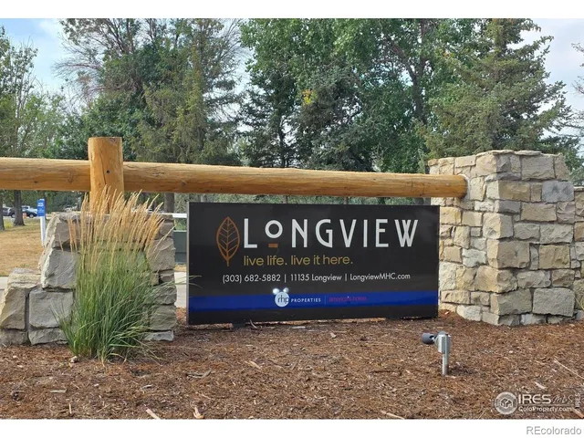 a view of a store with trees
