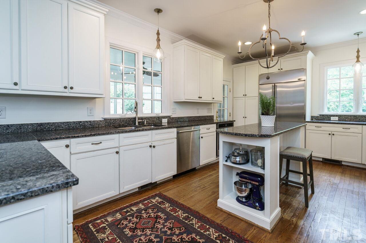 3201 Landor Road Raleigh, NC 27609 - Photo 11 of 41 a kitchen with a sink stove and cabinets