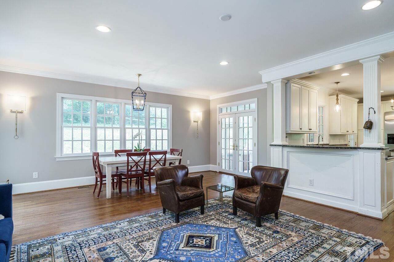 3201 Landor Road Raleigh, NC 27609 - Photo 17 of 41 a view of a dining room with furniture window and wooden floor