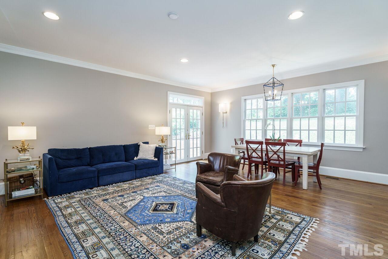 3201 Landor Road Raleigh, NC 27609 - Photo 19 of 41 a living room with furniture wooden floor and a table