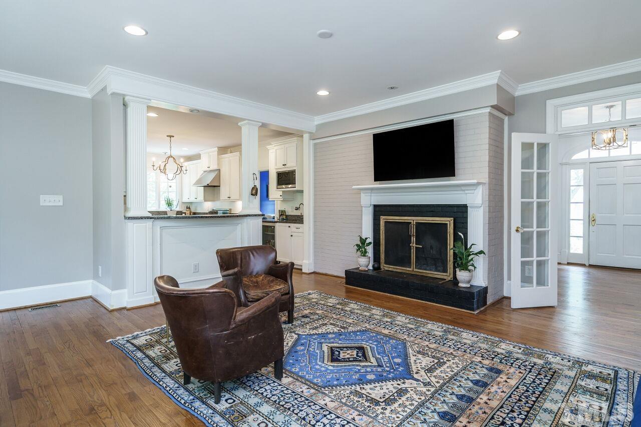 3201 Landor Road Raleigh, NC 27609 - Photo 21 of 41 a living room with furniture and a fireplace