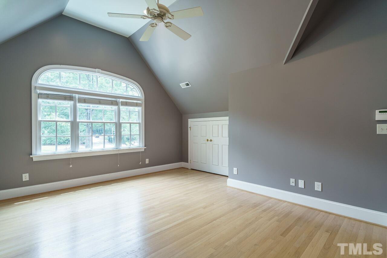 3201 Landor Road Raleigh, NC 27609 - Photo 25 of 41 an empty room with wooden floor and windows