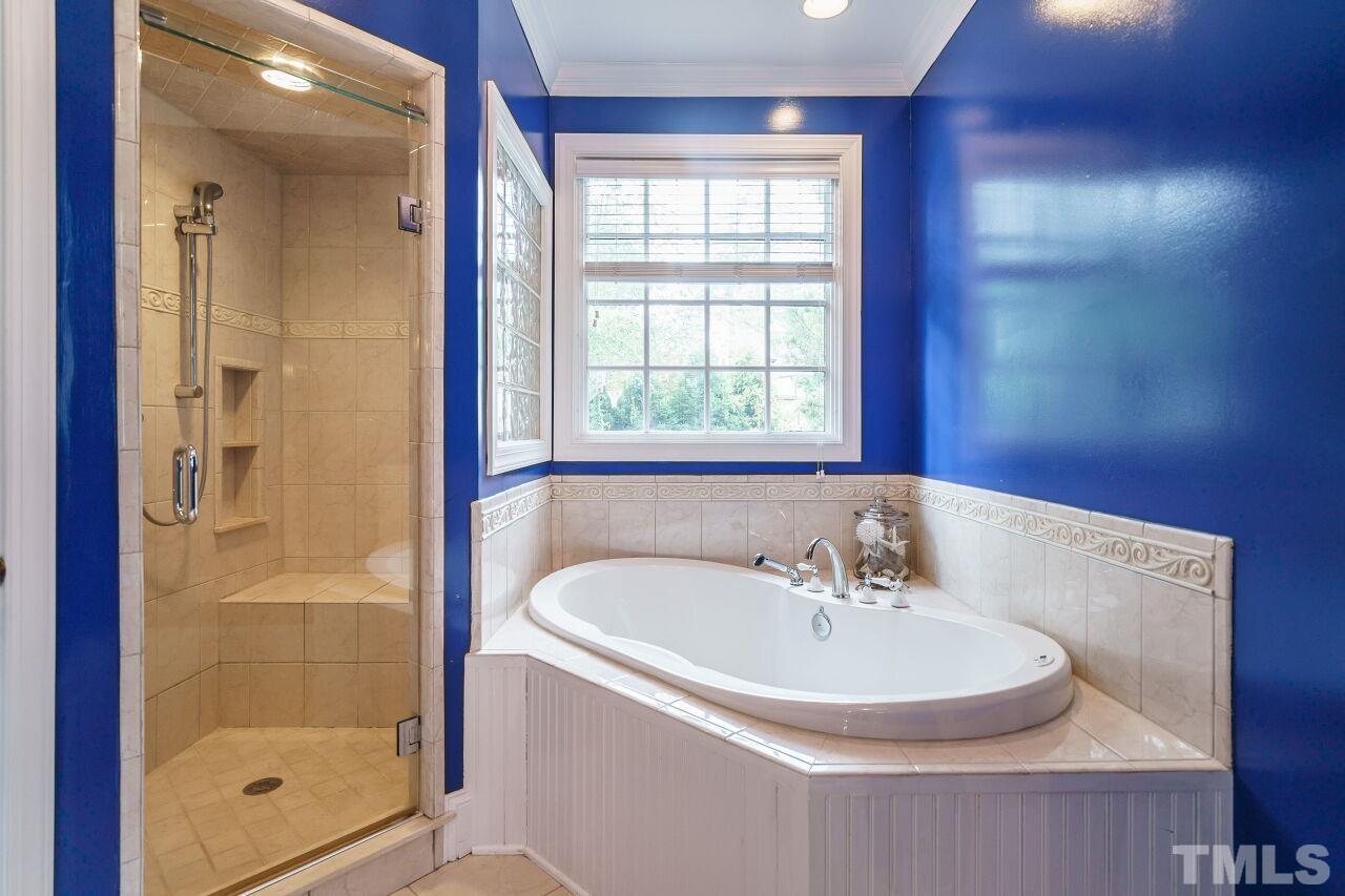 3201 Landor Road Raleigh, NC 27609 - Photo 28 of 41 a bathroom with a sink and a bathtub
