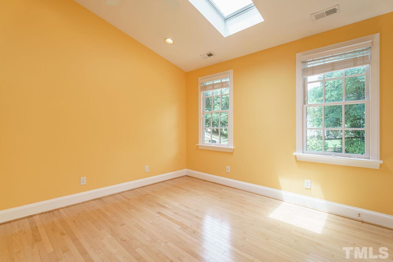 3201 Landor Road Raleigh, NC 27609 - Photo 29 of 41 a view of empty room with wooden floor and fan